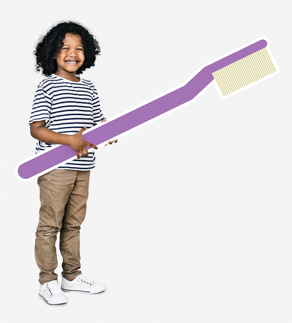 Cheerful kid holding a toothbrush