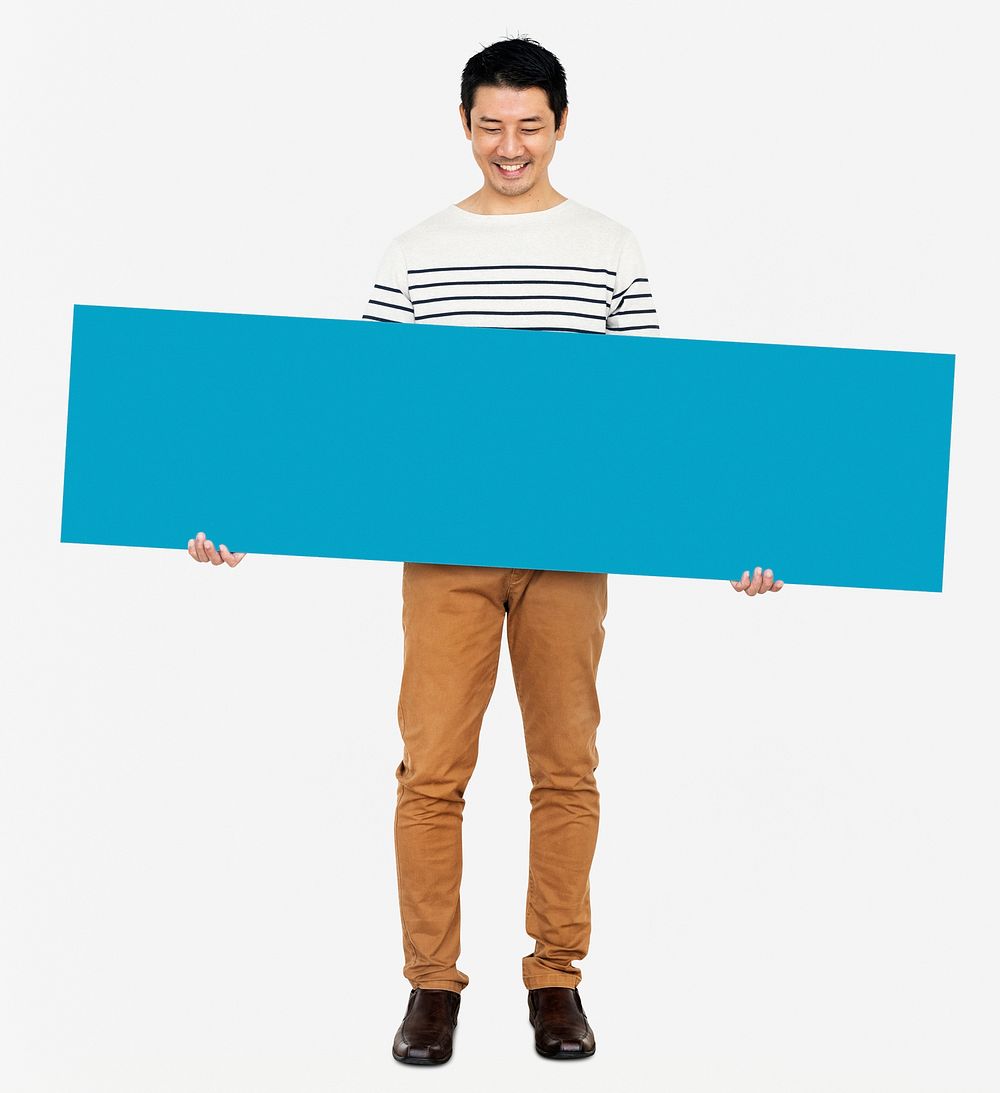 Cheerful man holding a blank blue banner