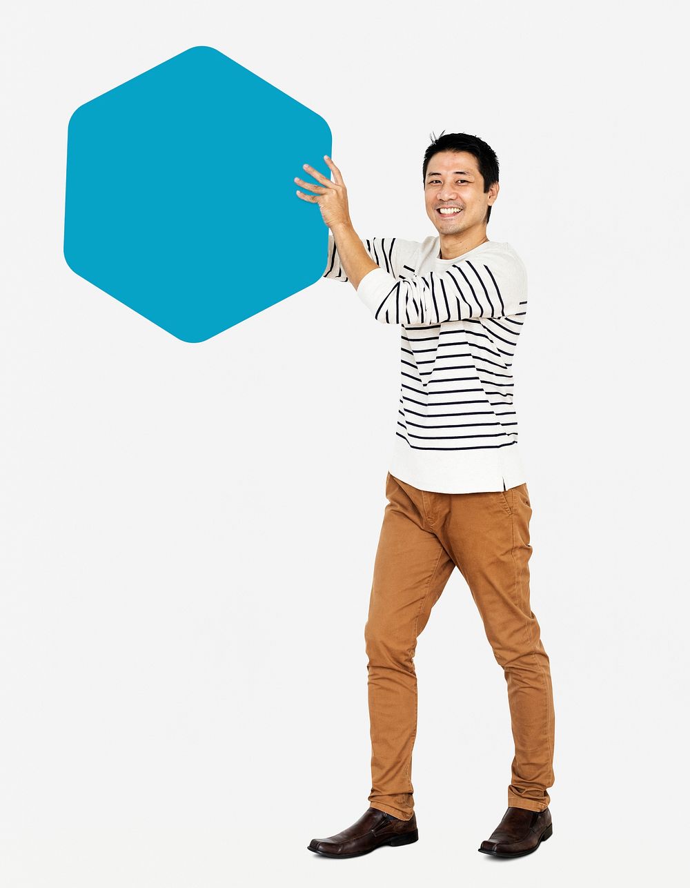 Cheerful man showing a blank blue hexagon board