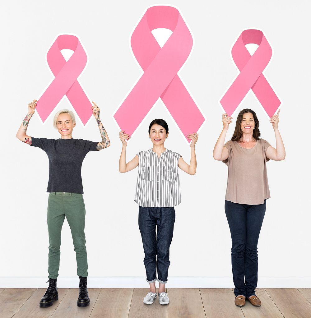 Women holding breast cancer ribbons