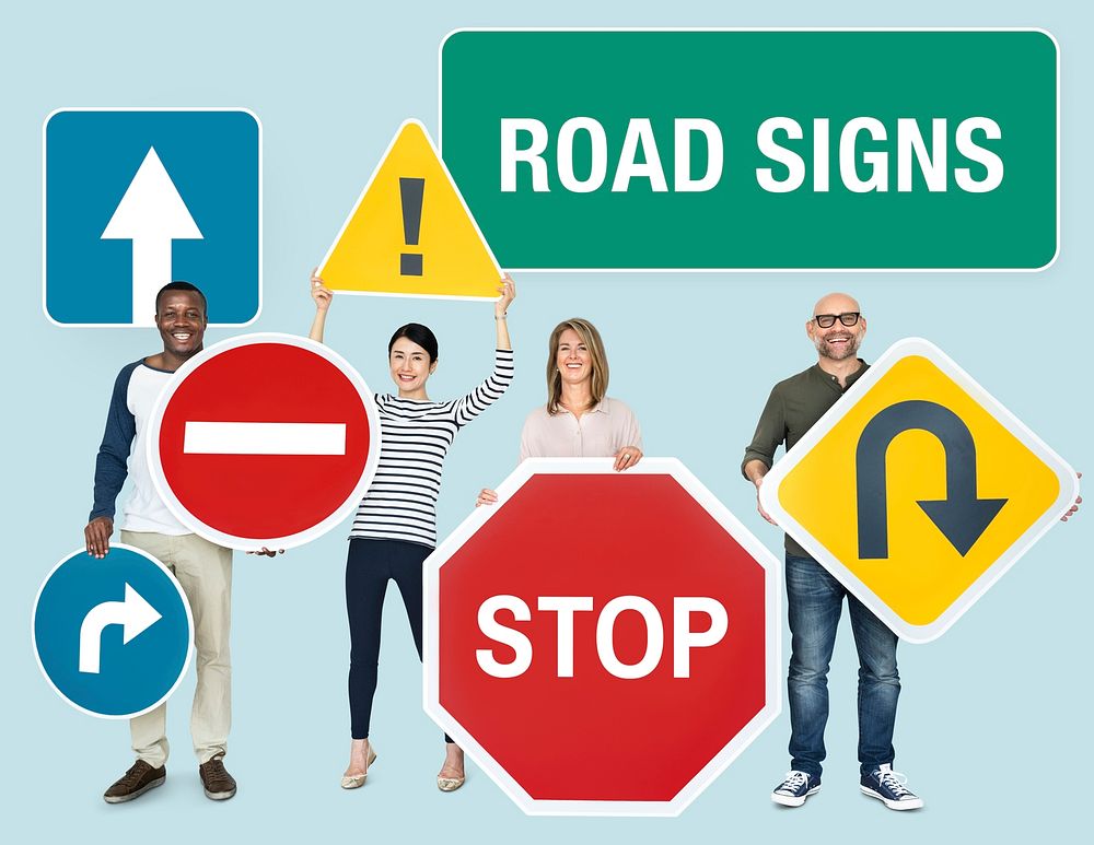 Happy diverse people holding road signs