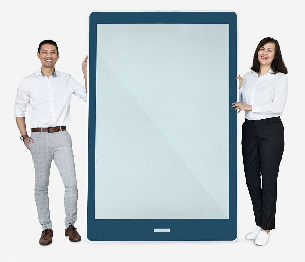 Cheerful people standing beside a tablet