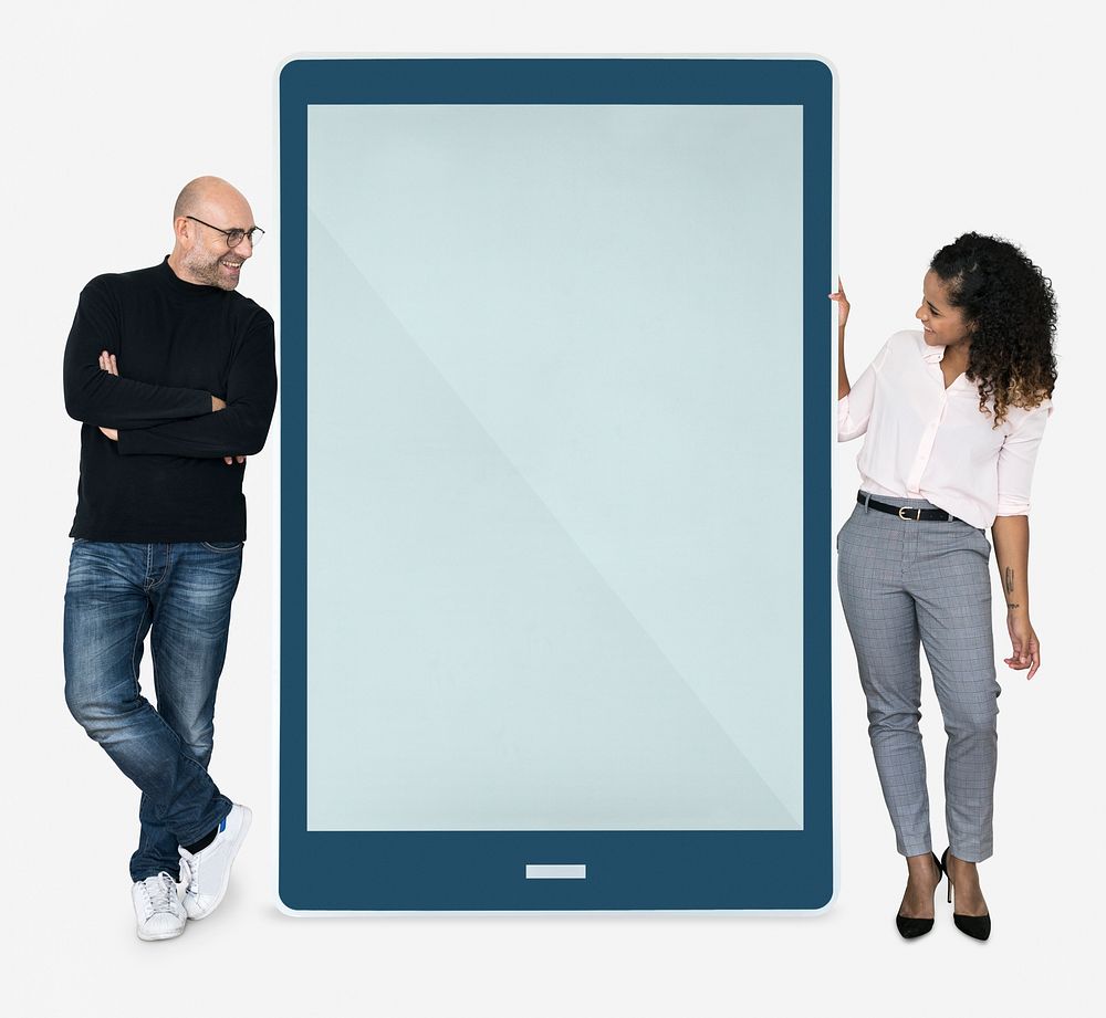 Cheerful people standing beside a tablet