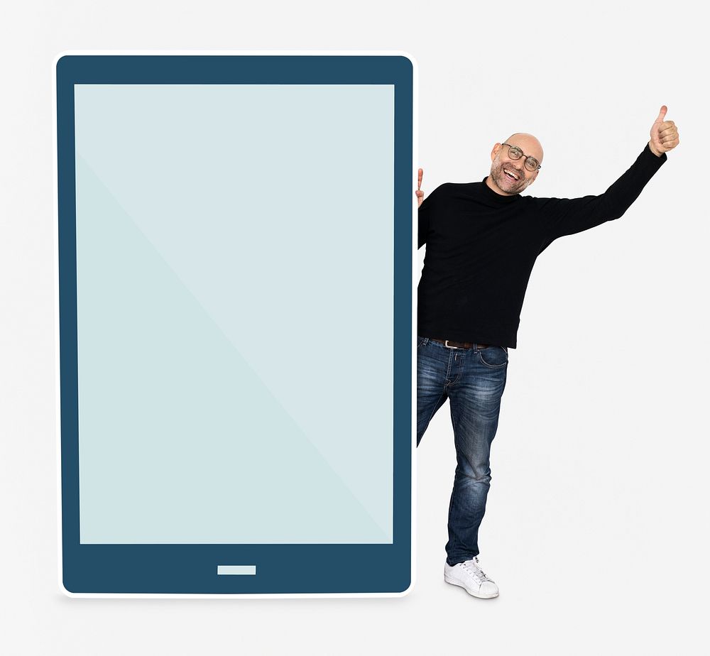 Cheerful man standing beside a tablet