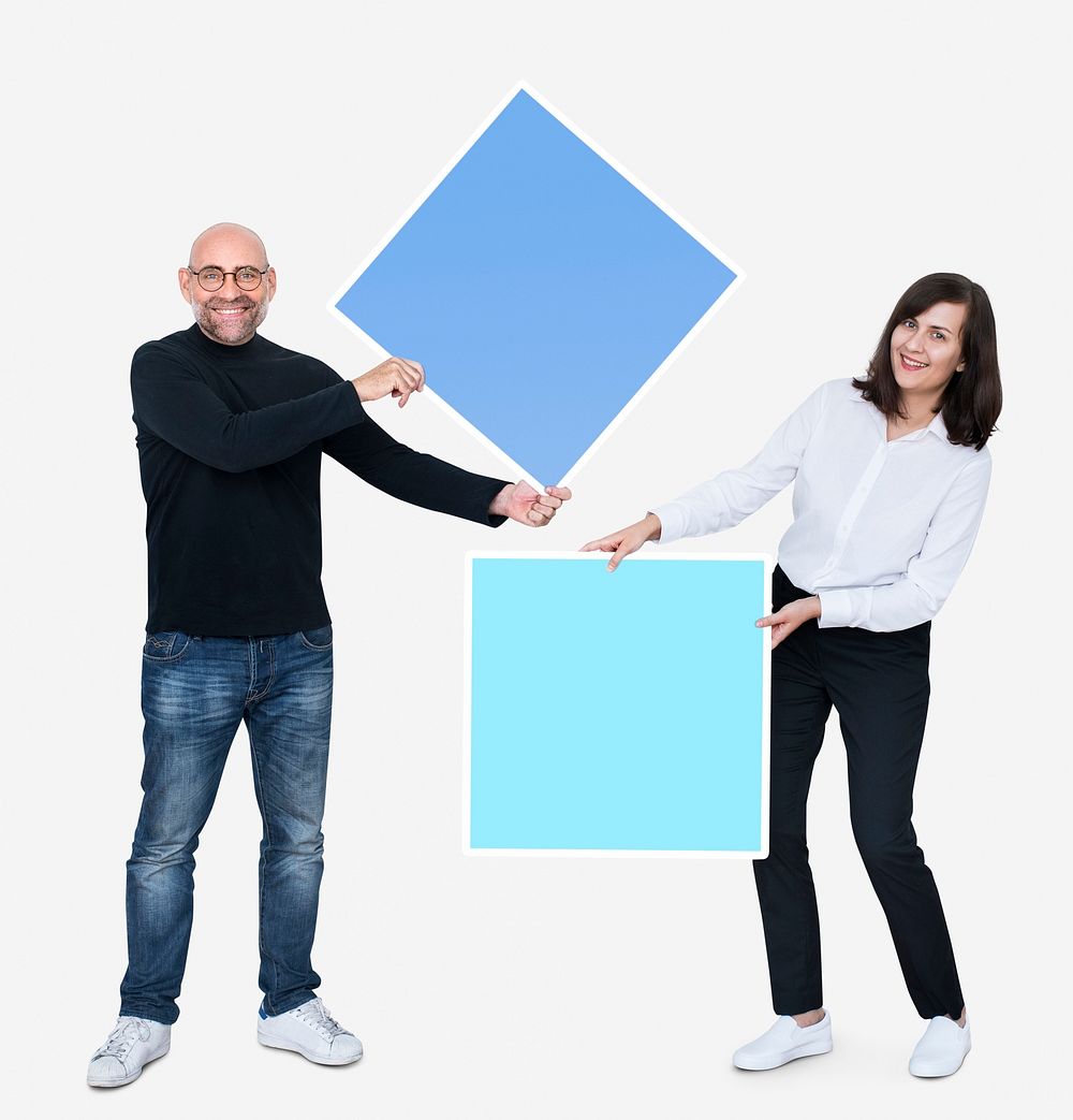 Man and woman holding squares