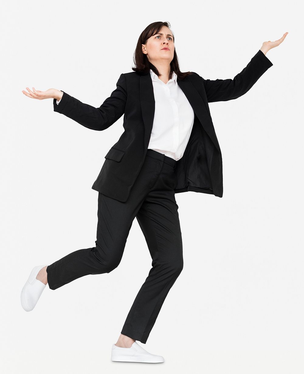 Confused young woman balancing herself on one leg