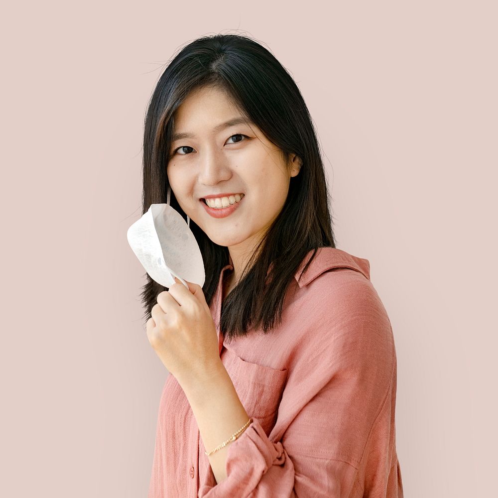 Smiling Asian woman with a mask mockup