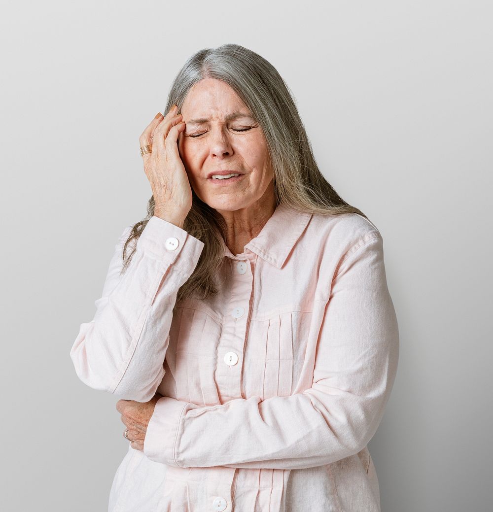 Sick senior woman having a headache during coronavirus pandemic mockup