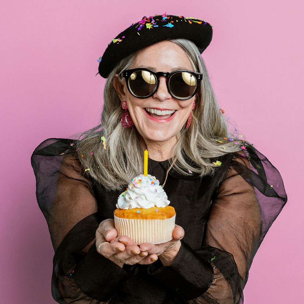 Cool grandma celebrating her birthday with a cupcake