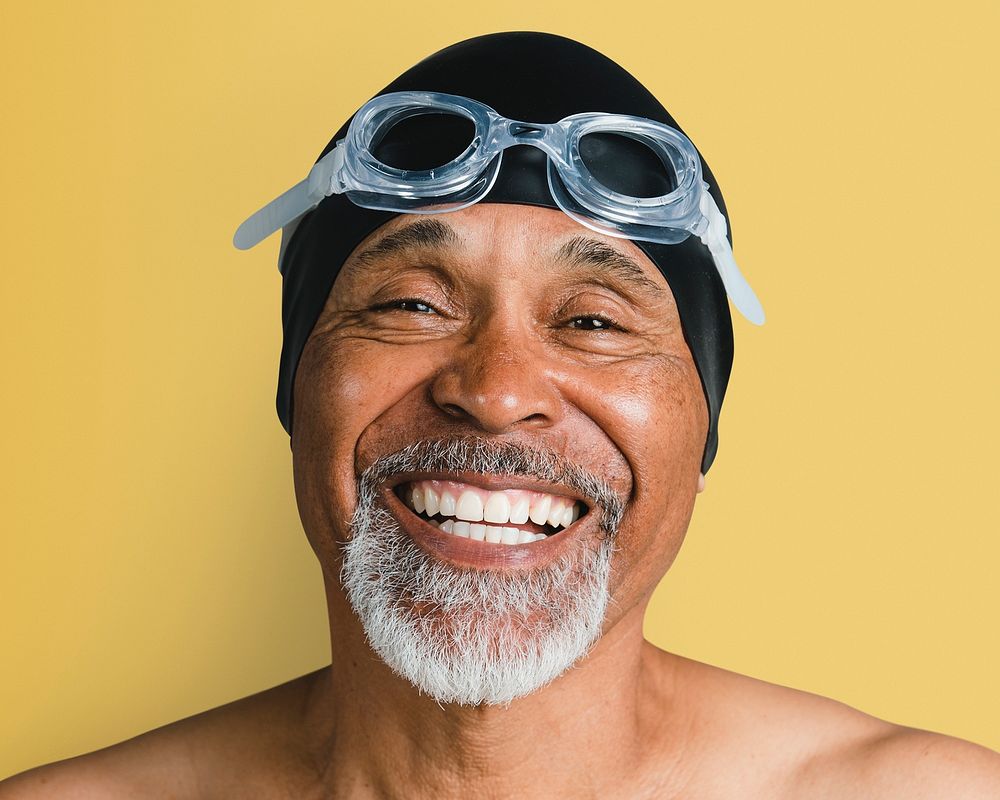 Senior man wearing swimming glasses, smiling face portrait psd