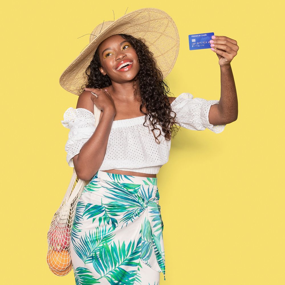 Tanned woman enjoying her summer vacation using a credit card mockup 