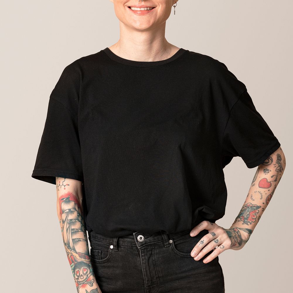 Tattooed model in black t shirt and jeans mockup