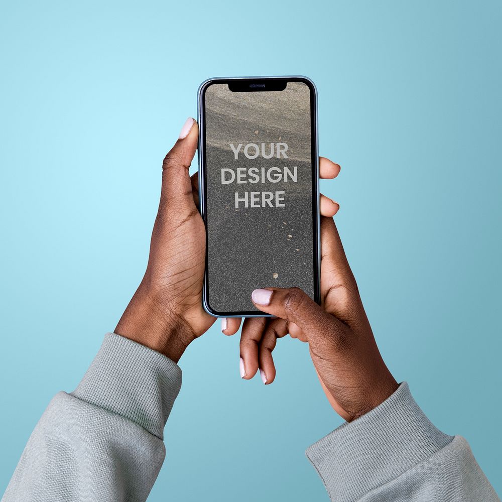 Hands holding a smartphone psd mockup