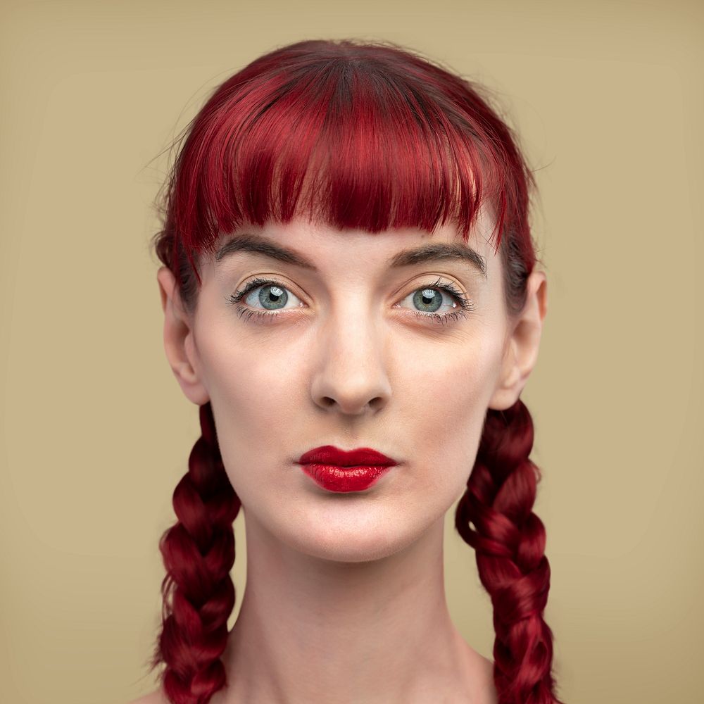Beautiful woman with braided red hair headshot 