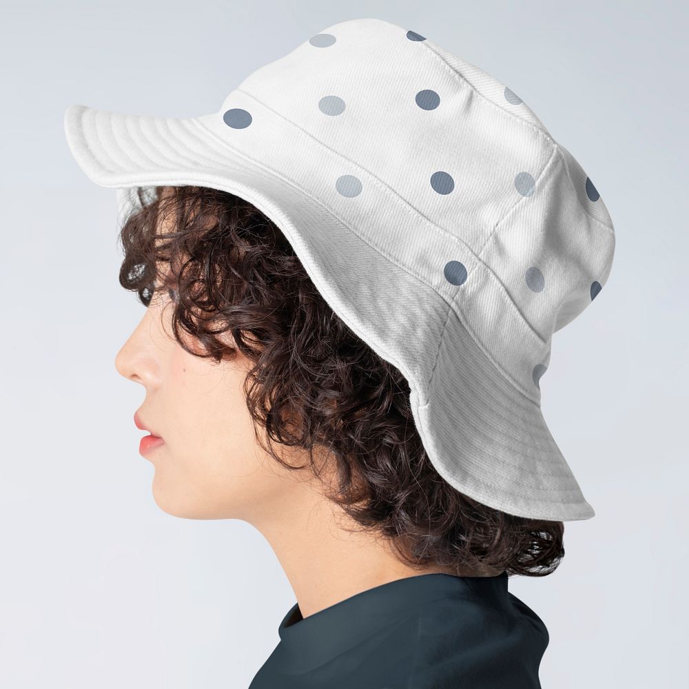 Beautiful woman wearing bucket hat with polka dot design