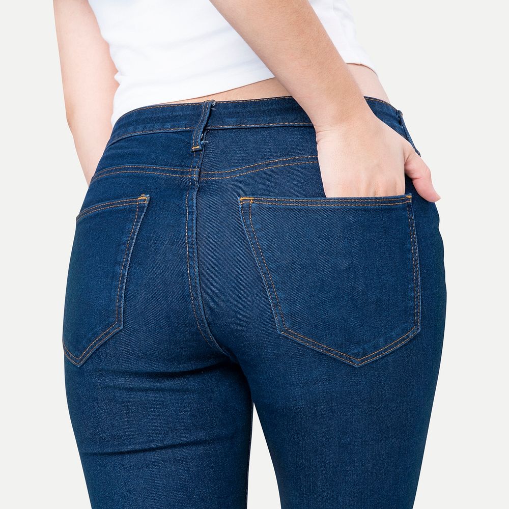 Woman in blue jeans with hand tucked in pocket rear view fashion photoshoot