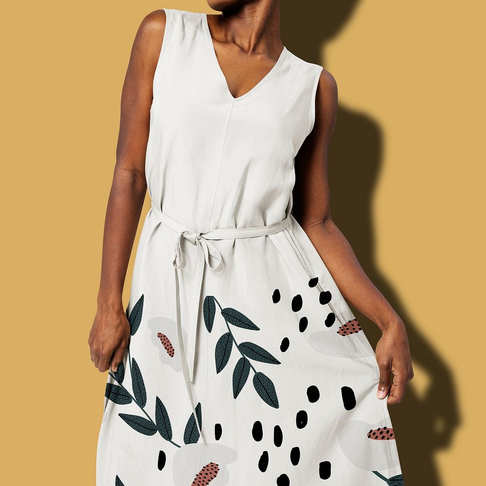 African American woman in belted white floral dress women&rsquo;s fashion shoot
