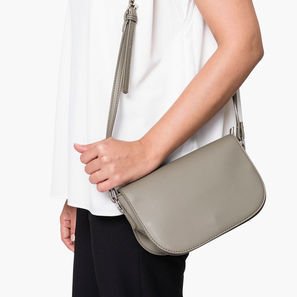 Woman carrying her gray leather crossbody bag