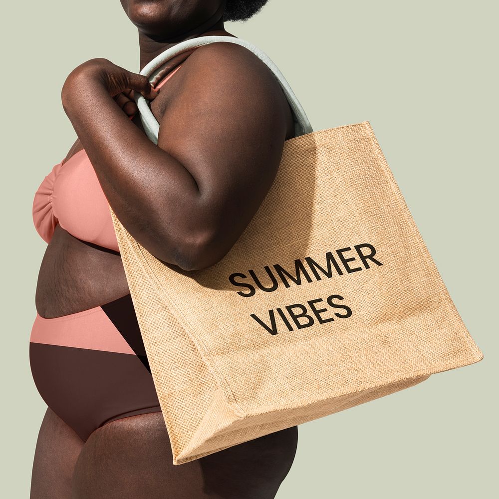 African American woman carrying a tote bag, ready for the beach 