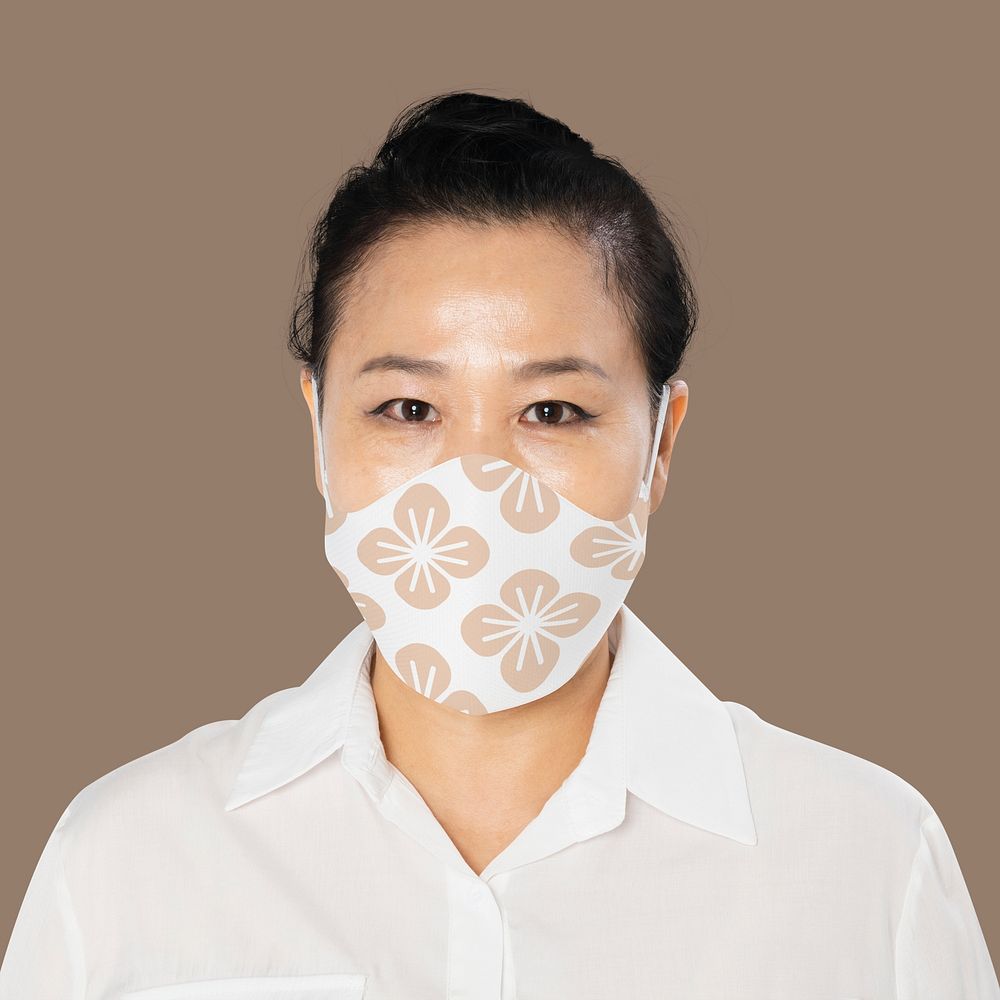 Mature woman wearing floral face mask in the new normal