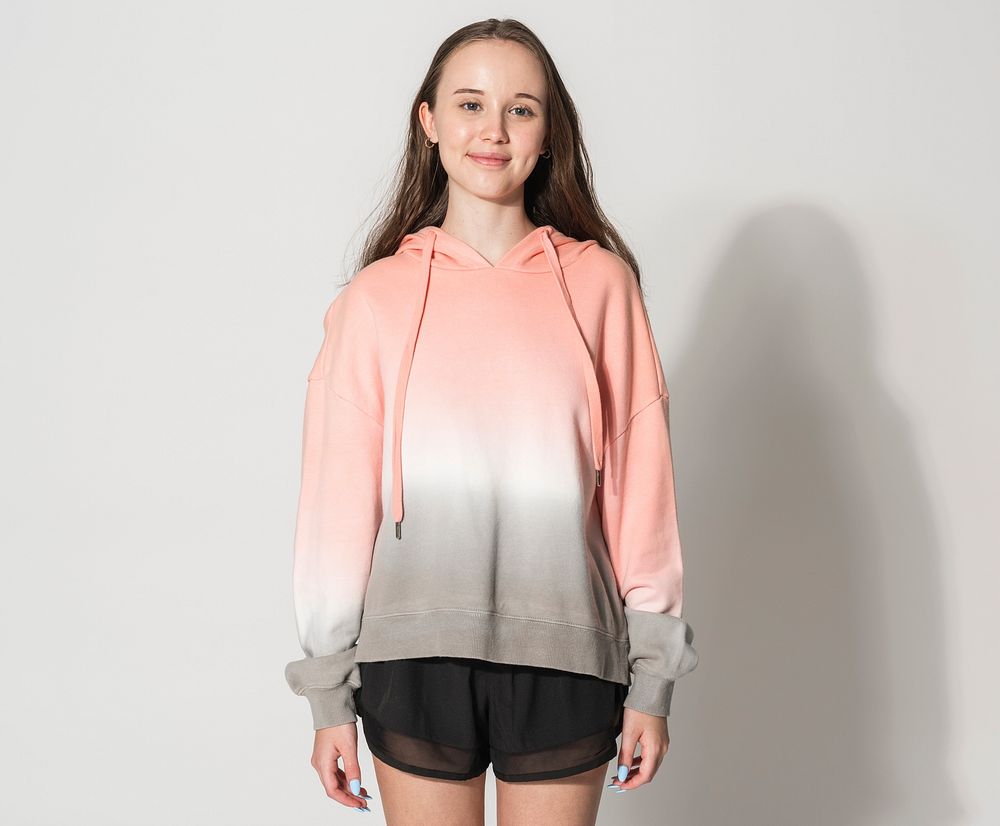 Teenage girl in Slay The Day orange hoodie for street fashion photoshoot