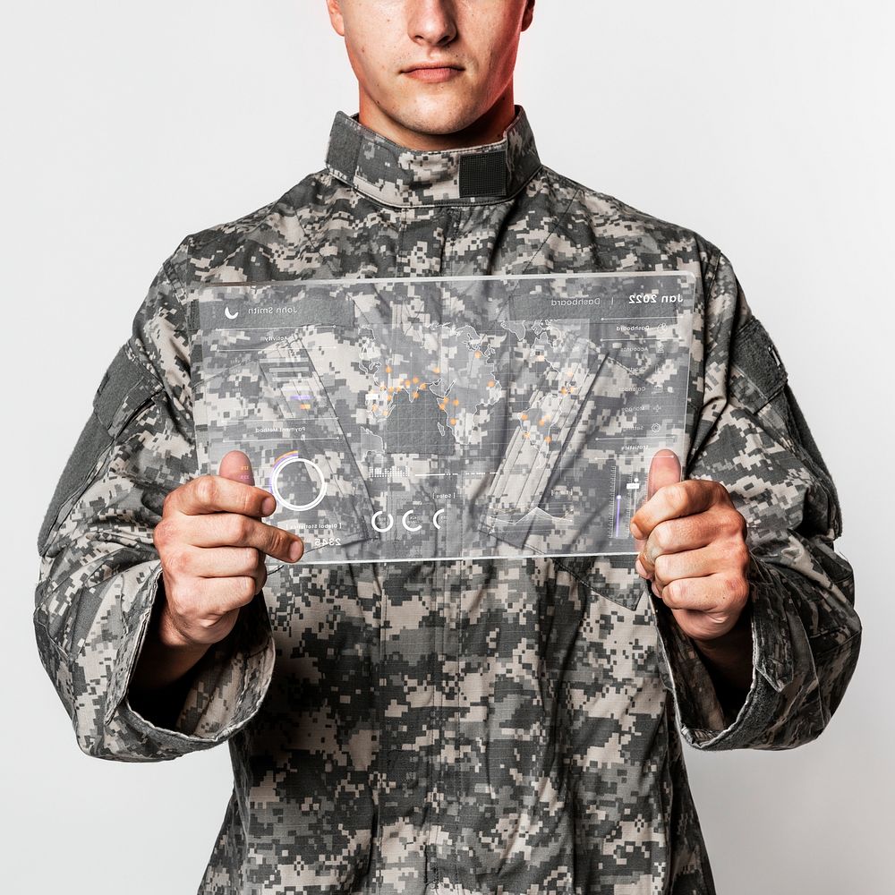Military man using transparent tablet training military technology
