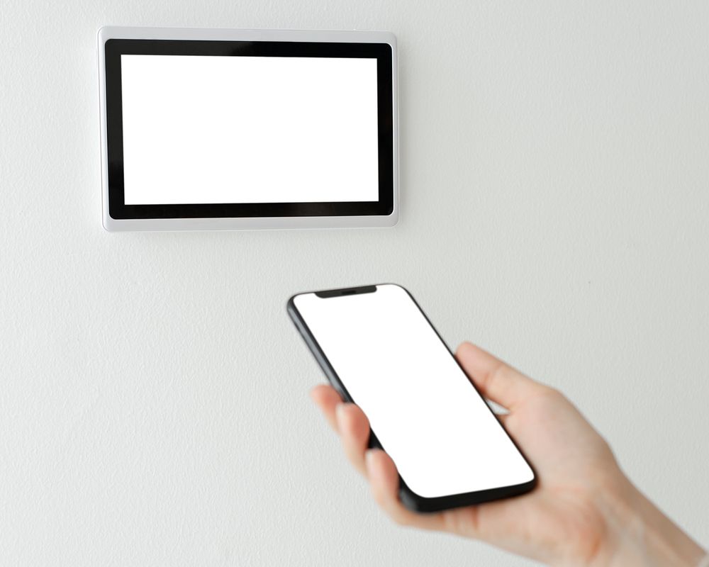 Smartphone screen mockup psd with smart home wall mount tablet