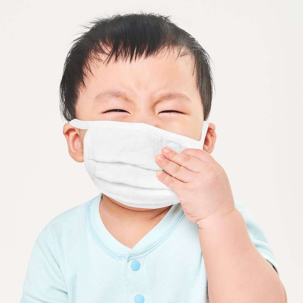 Psd child wearing face mask in studio mockup