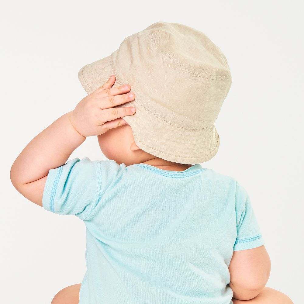 Baby wearing beige bucket hat 