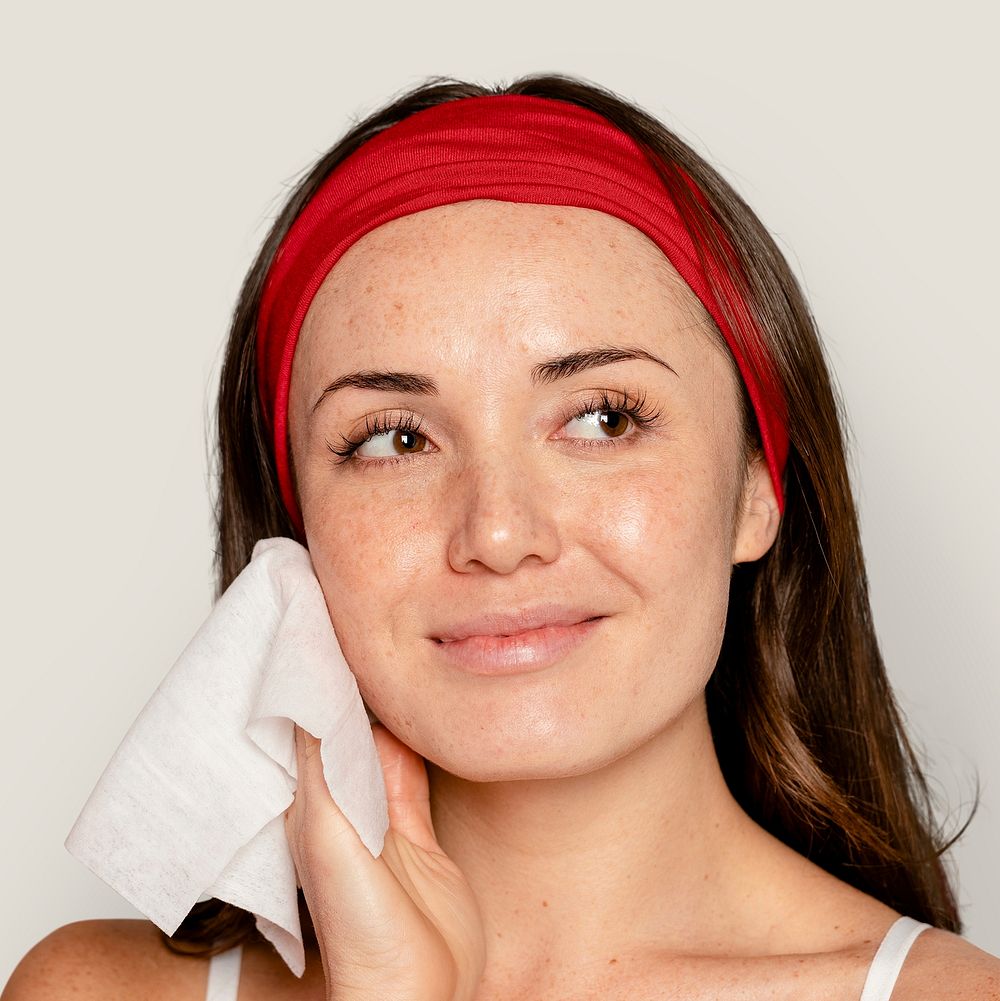 Face wipe, woman using makeup remover wet tissue 