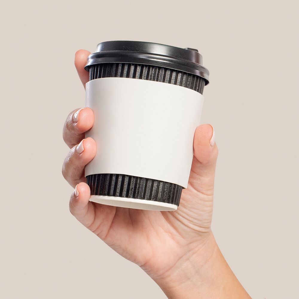 Coffee cup sleeve mockup psd held by woman's hand
