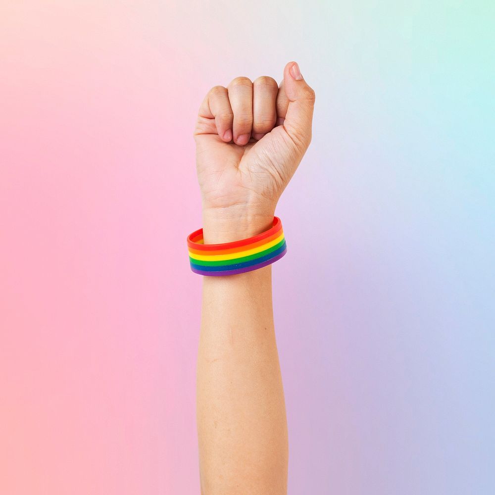  LGBTQ+ pride bracelet mockup psd with fist in the air