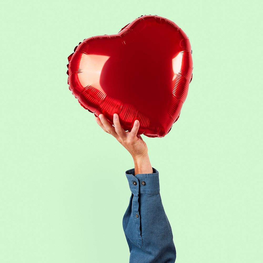 Valentines heart balloon mockup psd held by a person