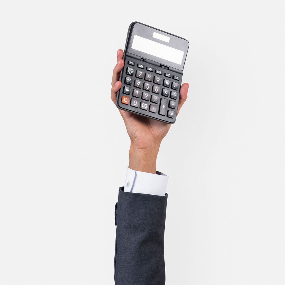 Hand holding calculator in finance concept