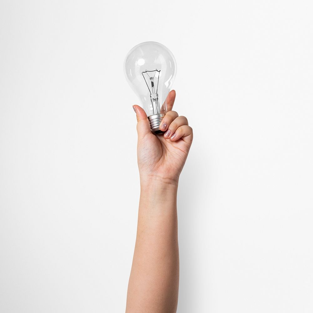 Light bulb creative mockup psd business idea symbol held by a hand
