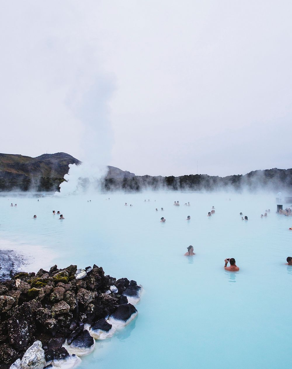 People swimming in hot spring. Original public domain image from Wikimedia Commons