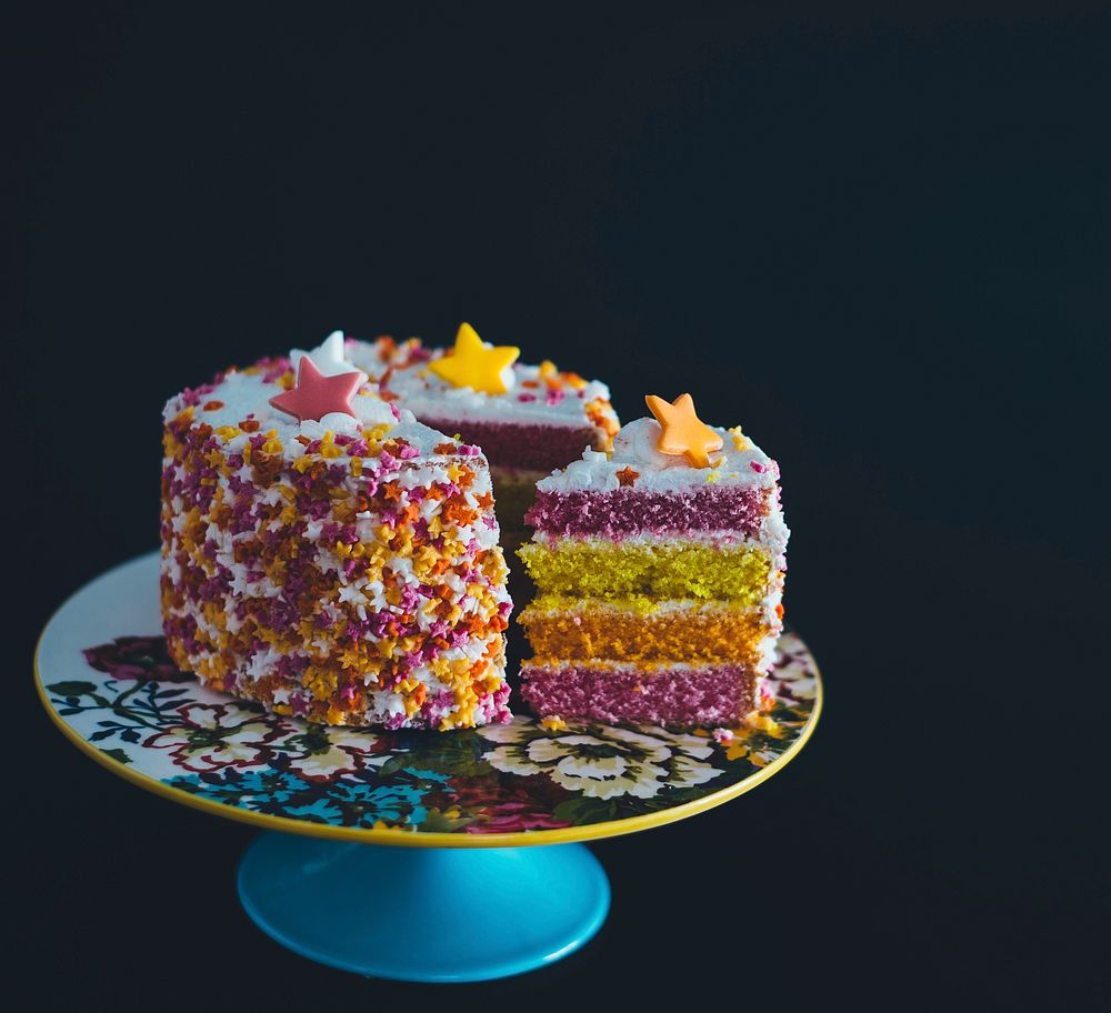 Colorful birthday cake with candy frosting stars. Original public domain image from Wikimedia Commons