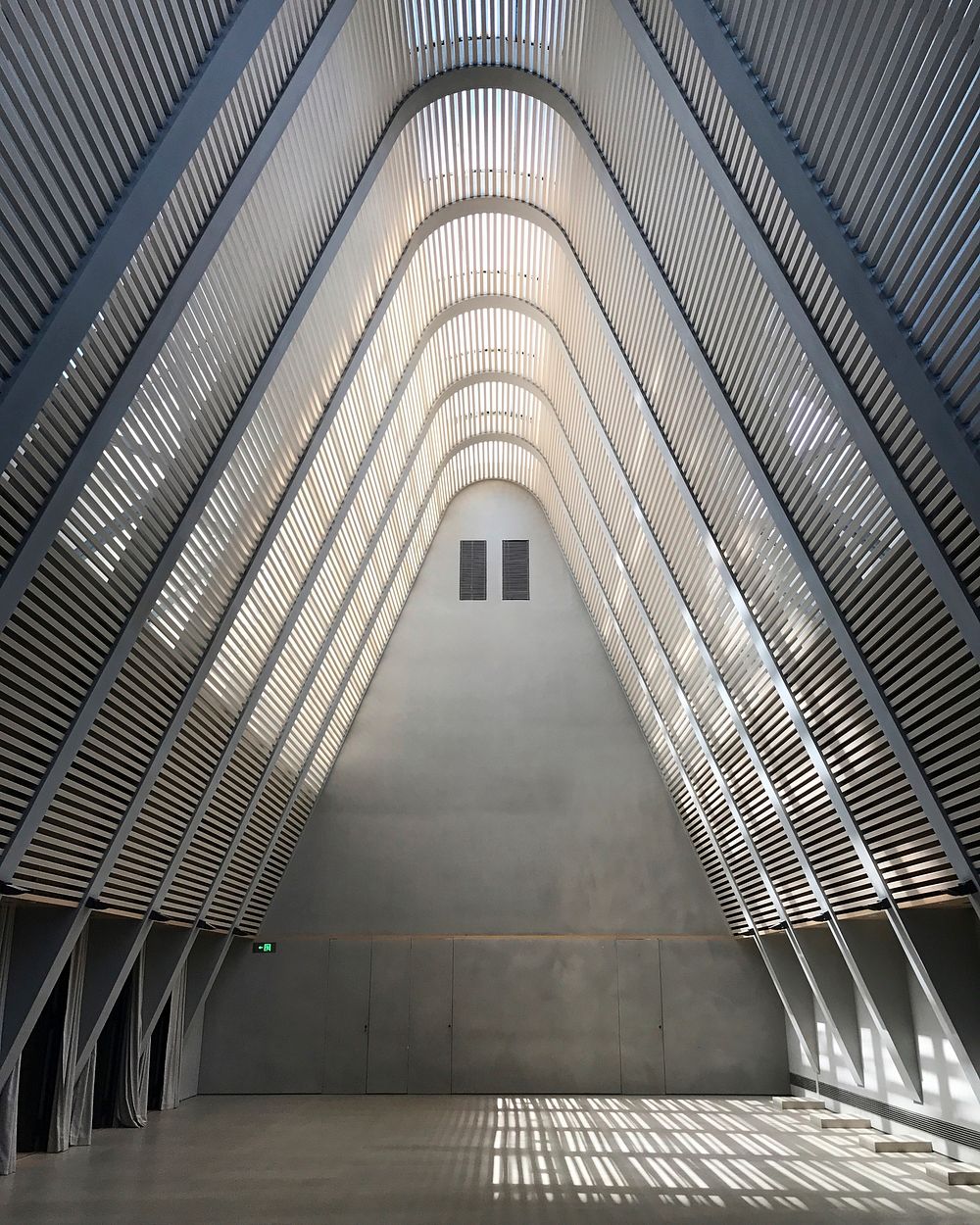 Triangle arch interior in CHAO Hotel & Clubhouse, Beijing, China.Original public domain image from Wikimedia Commons