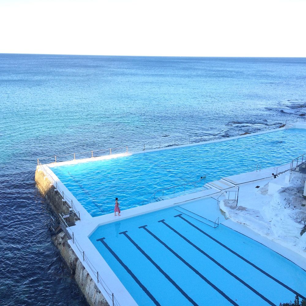 Two swimming pools on the ocean coast at Bondi Beach. Original public domain image from Wikimedia Commons