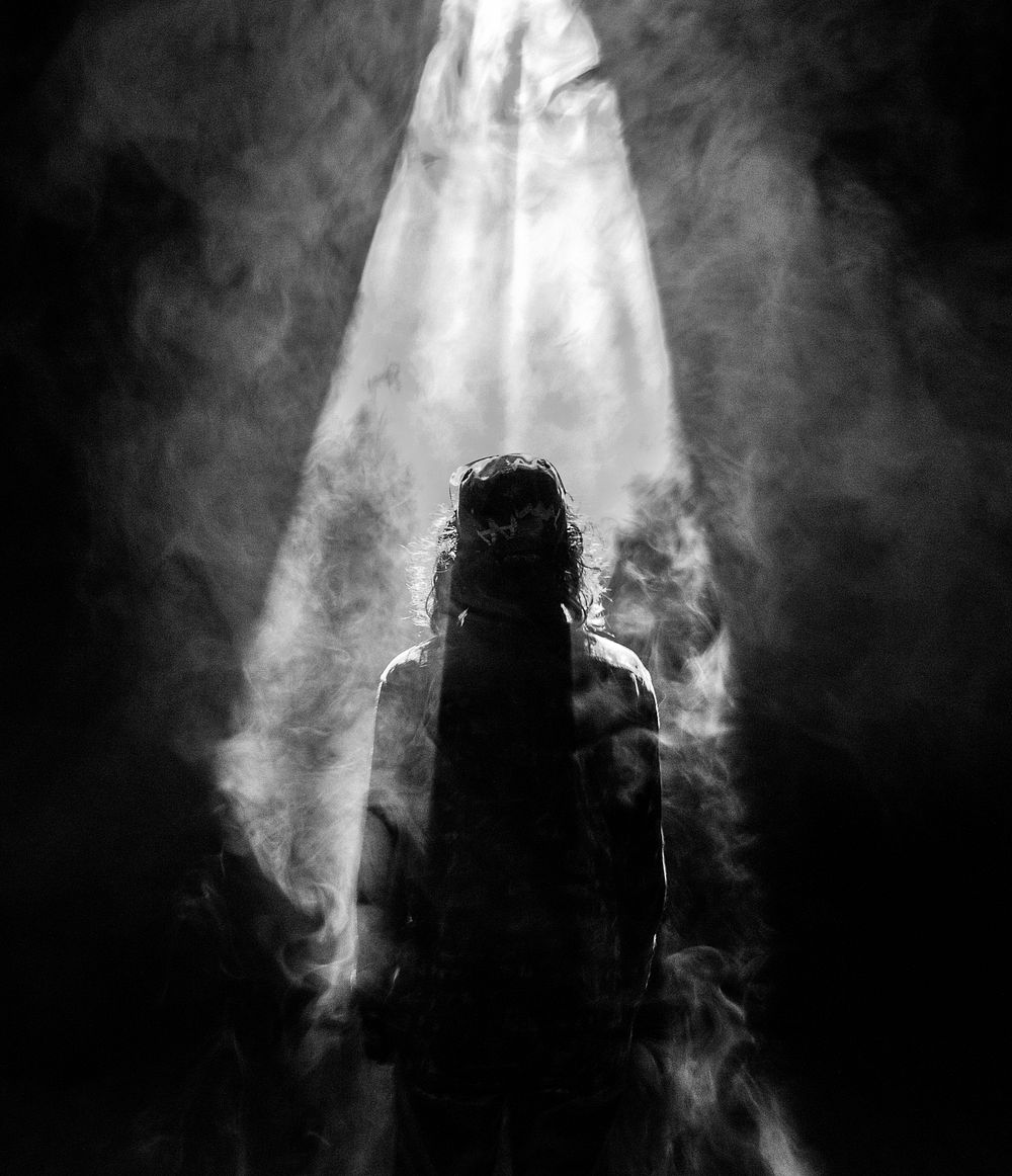Person's silhouette engulfed in smoke. Original public domain image from Wikimedia Commons