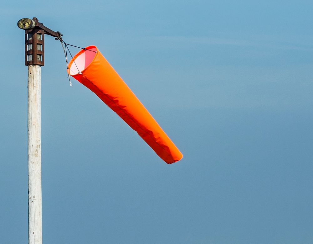 Windsock blowing in the breeze. Original public domain image from Wikimedia Commons