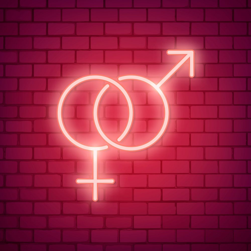 Neon light sex symbol on red brick wall