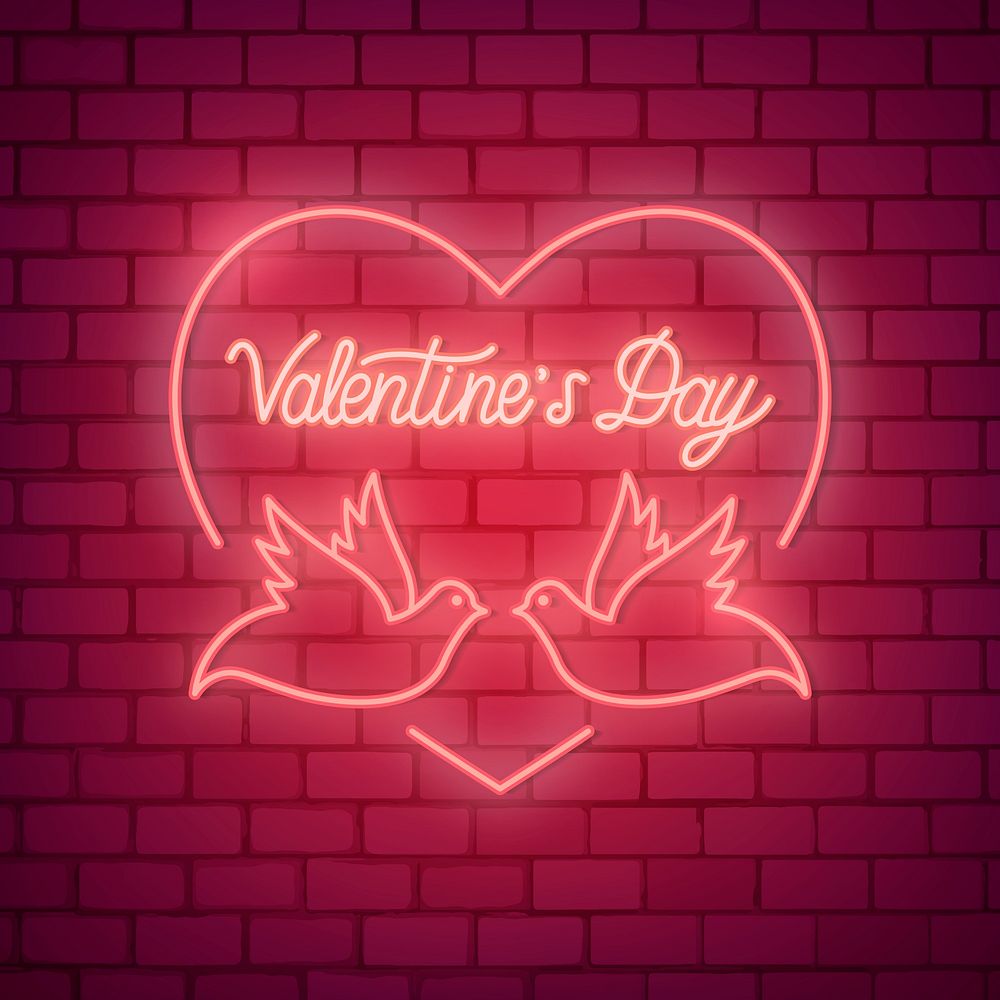 Neon light Valentine's day symbol on brick wall