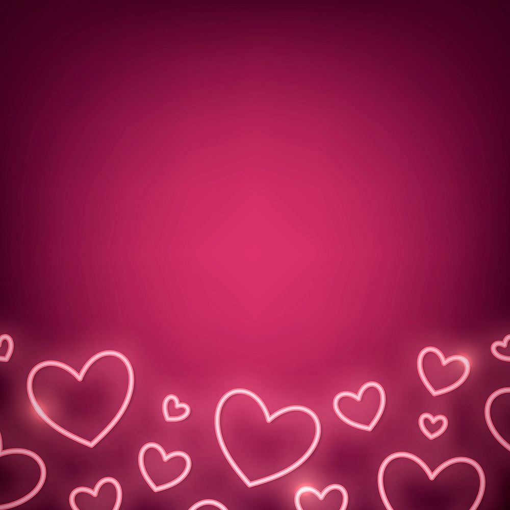 Neon light heart on pink background