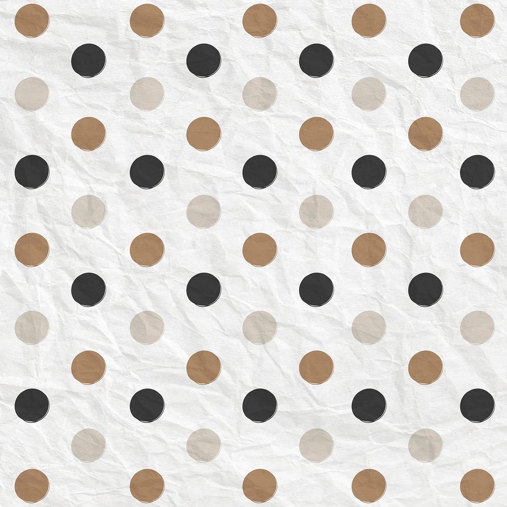 Polka dot pattern vector in black and gold on crumpled paper textured background