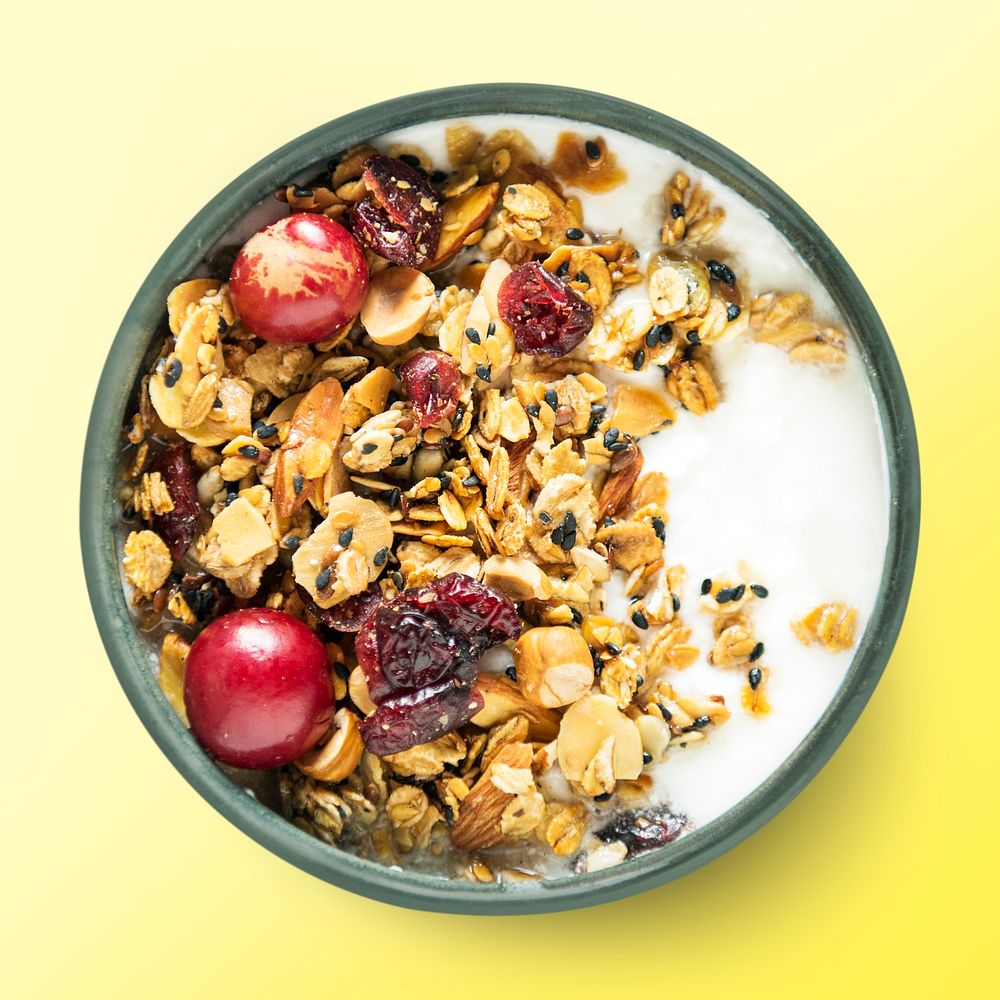 Yogurt bowl on yellow background, food photography, flat lay style