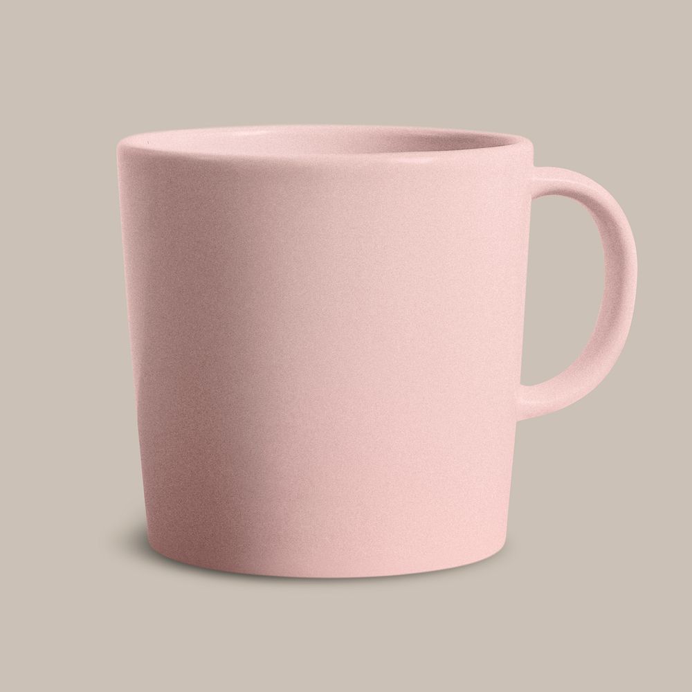 Pink ceramic coffee cup on beige background