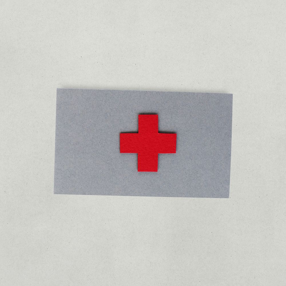 Paper craft design of red cross icon