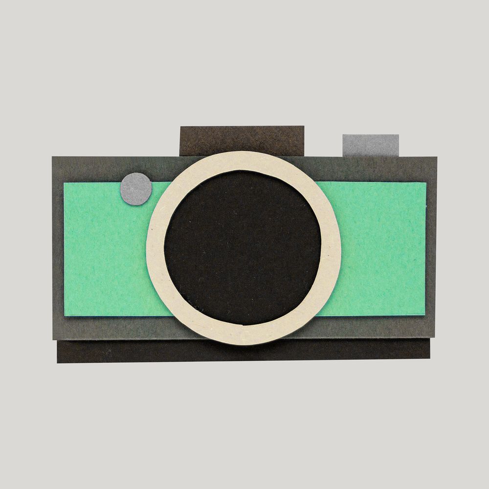 Green analog camera paper craft on gray background