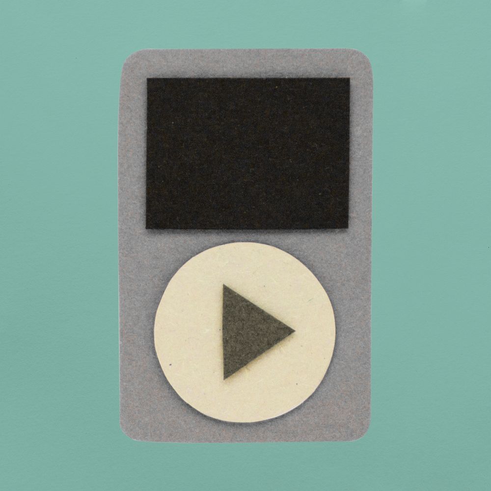 Gray music player paper craft on green background